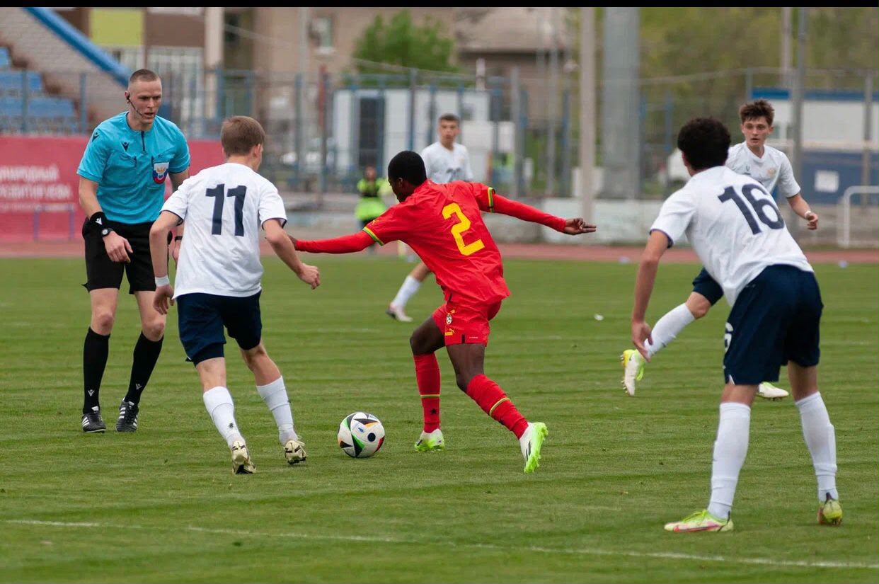 Young international footballer in match action